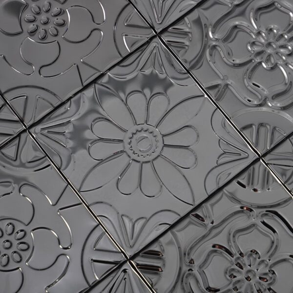 Black Embossed Patchwork Metal Mosaic Tile With Floral Patterns.
