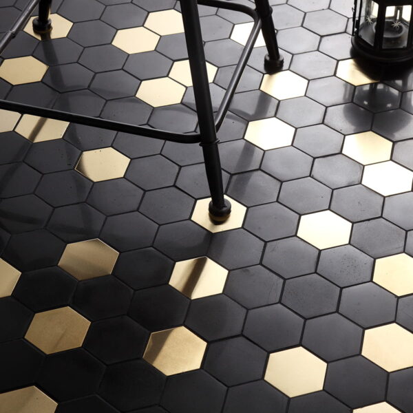 Black-and-gold-hexagonal-mosaic-tiles-with-a-chair-and-lantern-on-the-floor Large Mixed Metal Hexagon Floor Mosaic Tiles