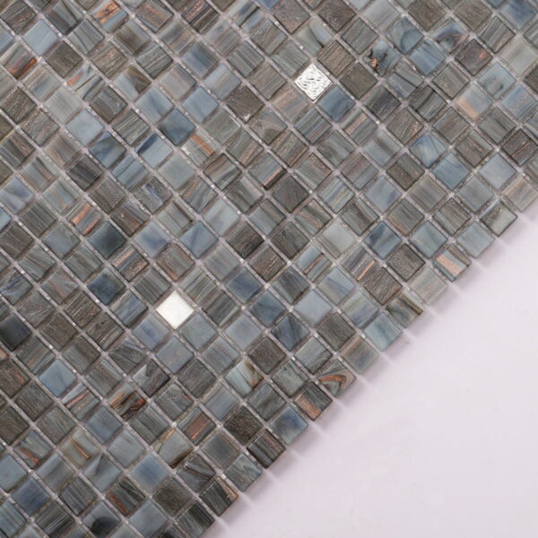 Close-up-of-blue-gray-mini-glass-mosaic-tiles-with-metallic-accents-in-a-grid-pattern Deep Gray Mixed Platinum Mini Glass Mosaic Tiles