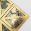 Close-up-of-gold-and-green-geometric-mosaic-tile Green Glass with Gold Framed Mosaic Wall Tile