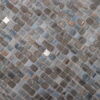 Shimmering-glass-mosaic-tile-featuring-swirled-gray-tones-and-scattered-mirrored-inserts Deep Gray Mixed Platinum Mini Glass Mosaic Tiles