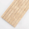 angled-view-of-ribbed-beige-stone-tile Long Beige Travertine Fluted Stone Strip Wall Tile