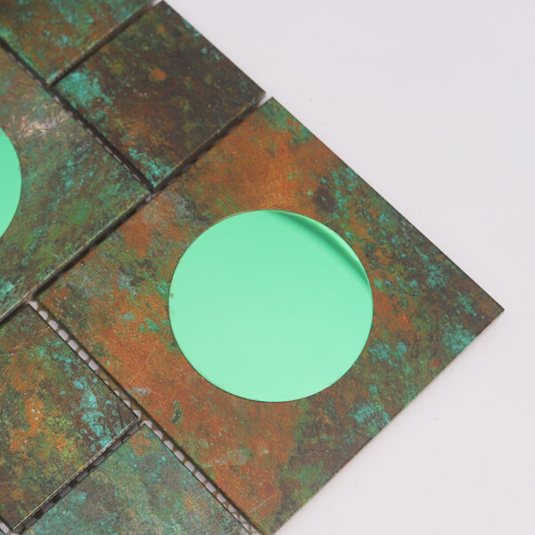 corner-close-up-of-weathered-patina-bronze-aluminum-tiles Bronze Aluminum Metal Wall Tile with Mint Green Glass Accents