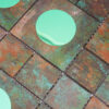 detailed-texture-of-mint-green-glass-circle-in-patina-tile Bronze Aluminum Metal Wall Tile with Mint Green Glass Accents