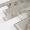 translucent-gray-glass-strip-mosaic-edge-detail Gray Veined Linear Glass Mosaic Tile With Mixed Long Strip