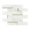 White Marble Glass Subway Tile In Staggered Pattern With Slim Gold Line Accents